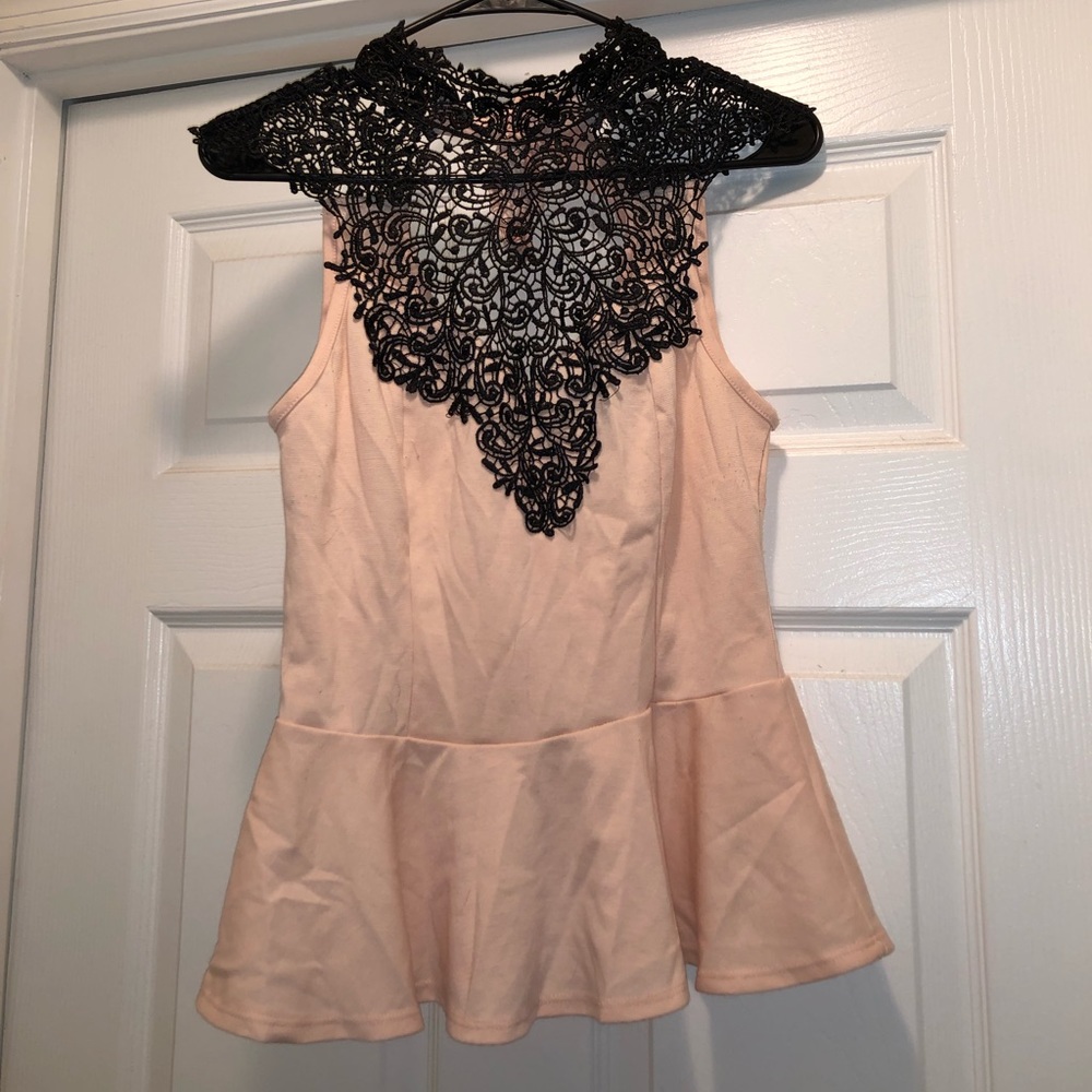 Pale pink and black peplum high neck blouse.